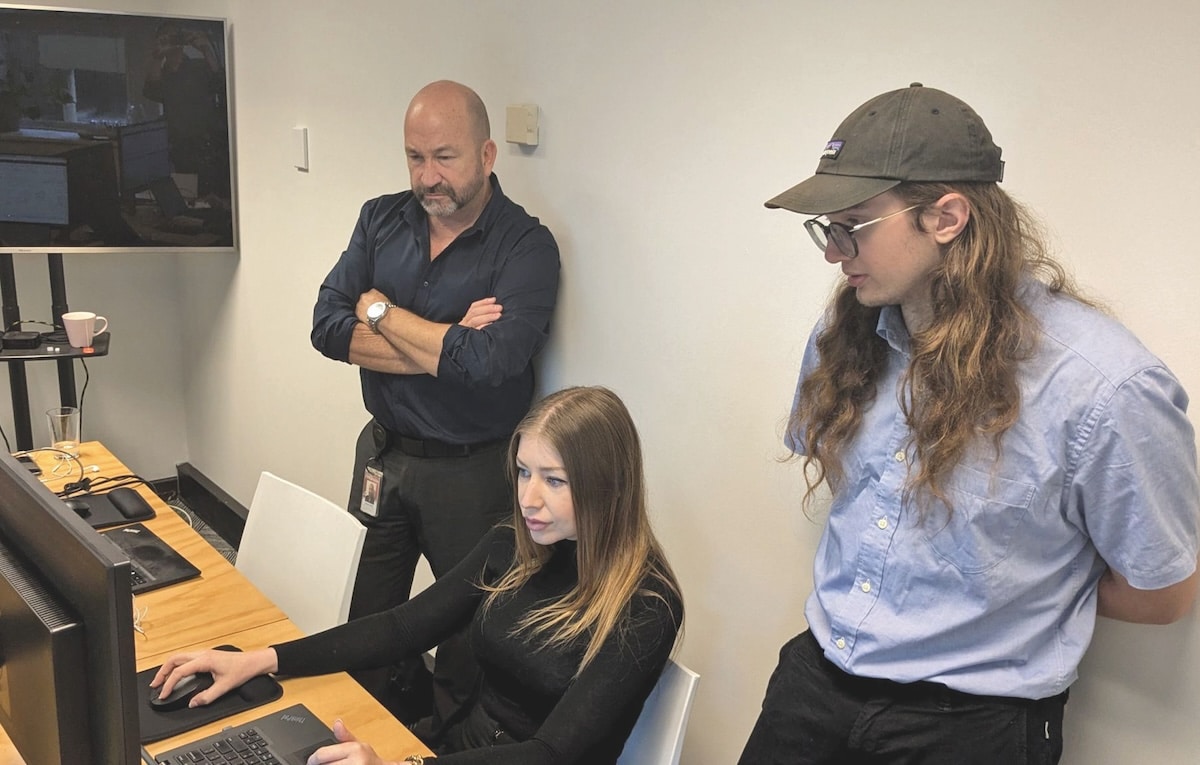 Adiona Tech team members review route optimisation outputs during a client implementation session in Sydney. Images: Adiona